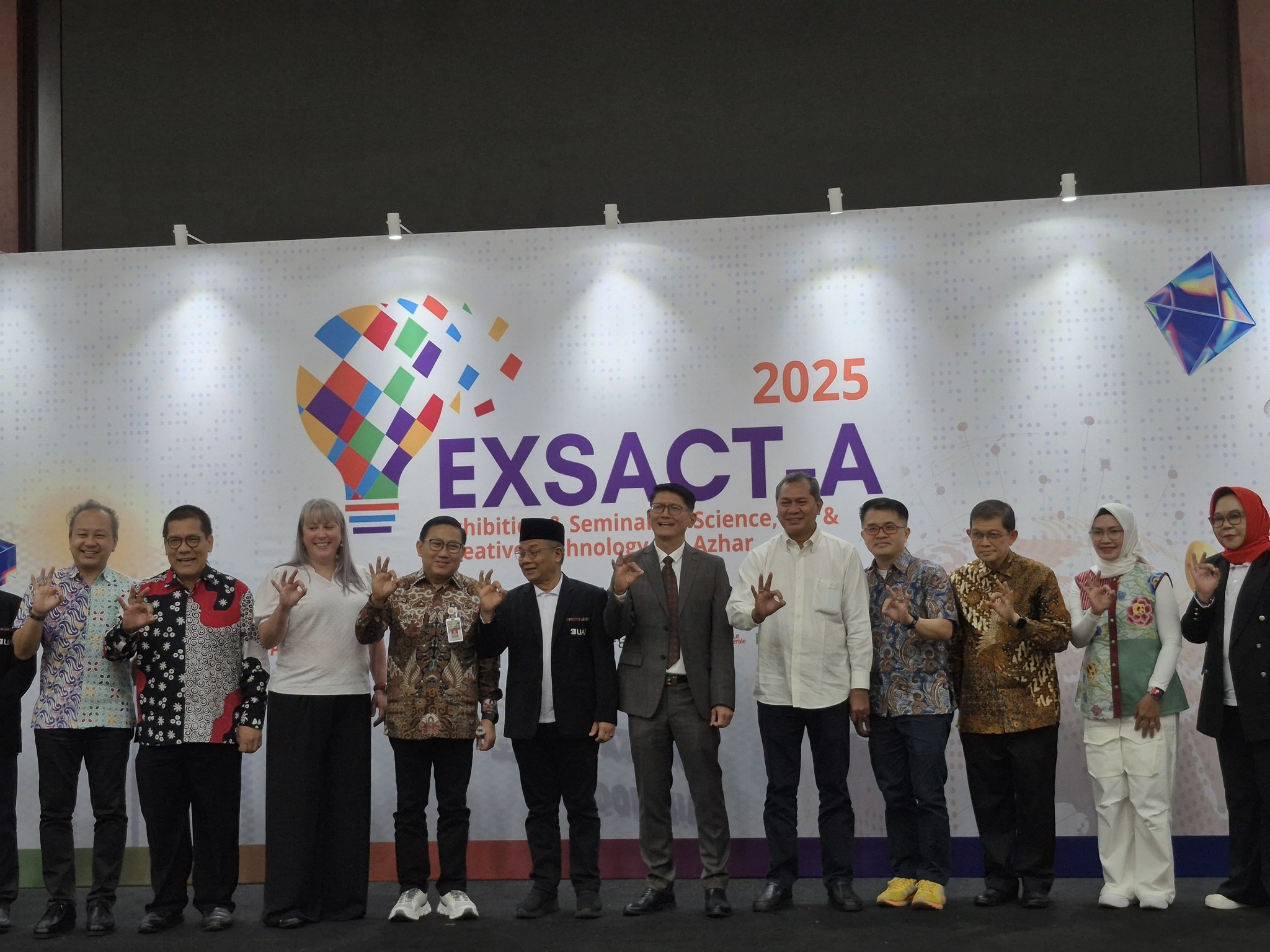May be an image of 12 people, dais and text that says "2025 EXSACT A hibiti Seminal Science, & eativa hnology Azhar"